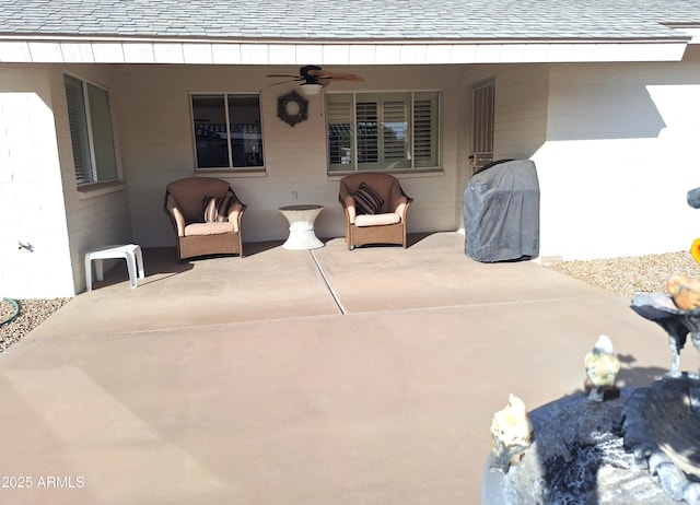 view of patio / terrace featuring ceiling fan and a grill