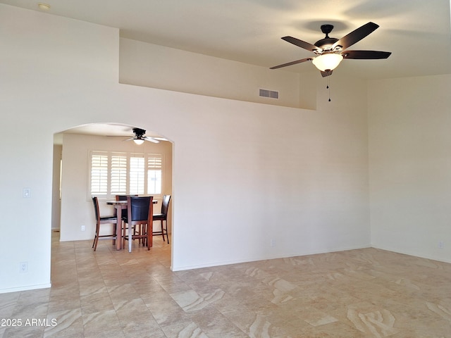 unfurnished room with ceiling fan