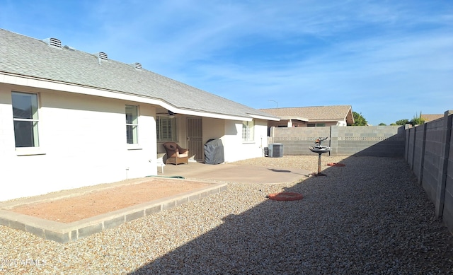 view of yard featuring a patio area and central air condition unit