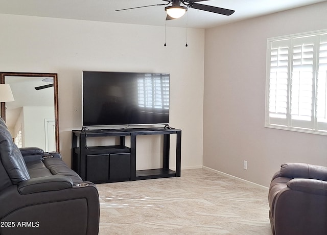 living room featuring ceiling fan