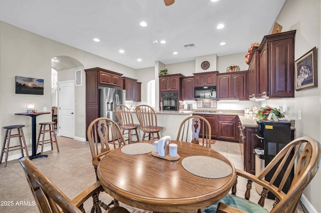 3125 W Desert Ln, Laveen, AZ 85339 - dining room with arched walkways, recessed lighting, and light tile patterned flooring
