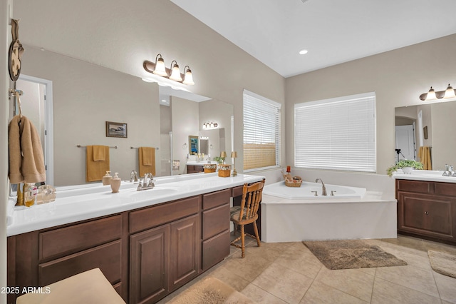 3125 W Desert Ln, Laveen, AZ 85339 - bathroom with two vanities, a bath, and tile patterned floors