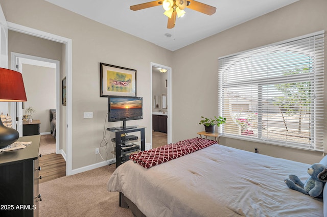 3125 W Desert Ln, Laveen, AZ 85339 - bedroom with light colored carpet, ensuite bath, and ceiling fan