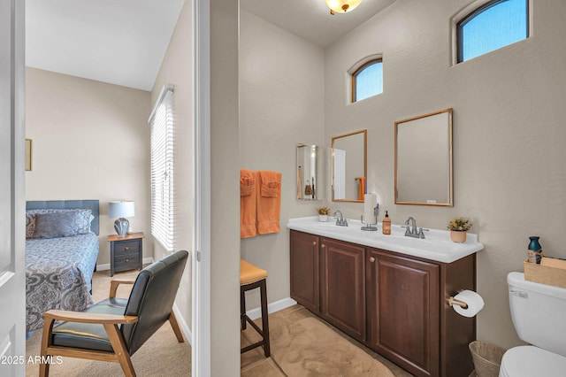 3125 W Desert Ln, Laveen, AZ 85339 - ensuite bathroom featuring double vanity and a towering ceiling