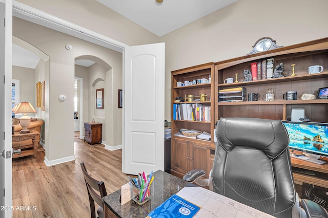3125 W Desert Ln, Laveen, AZ 85339 - home office featuring arched walkways and light wood-style floors
