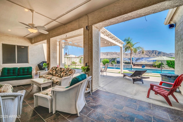 3125 W Desert Ln, Laveen, AZ 85339 - view of patio / terrace with a mountain view, a ceiling fan, and an outdoor hangout area