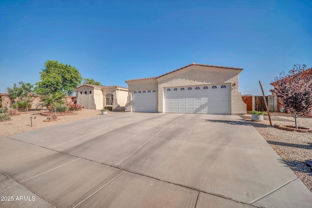 3125 W Desert Ln, Laveen, AZ 85339 - view of front of house featuring stucco siding, an attached garage, concrete driveway, and a tiled roof