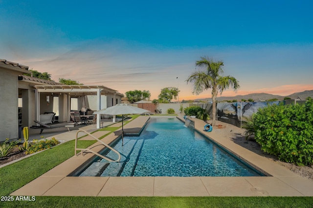 3125 W Desert Ln, Laveen, AZ 85339 - pool at dusk featuring a pergola and a patio area