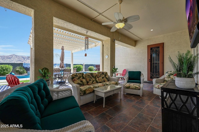 3125 W Desert Ln, Laveen, AZ 85339 - sunroom / solarium featuring healthy amount of natural light, a textured wall, a mountain view, and recessed lighting