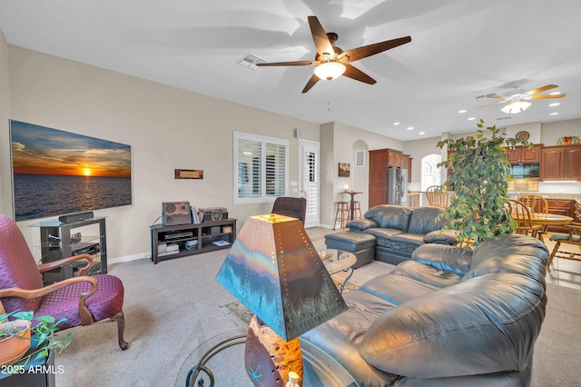 3125 W Desert Ln, Laveen, AZ 85339 - living area featuring ceiling fan, light colored carpet, arched walkways, and recessed lighting