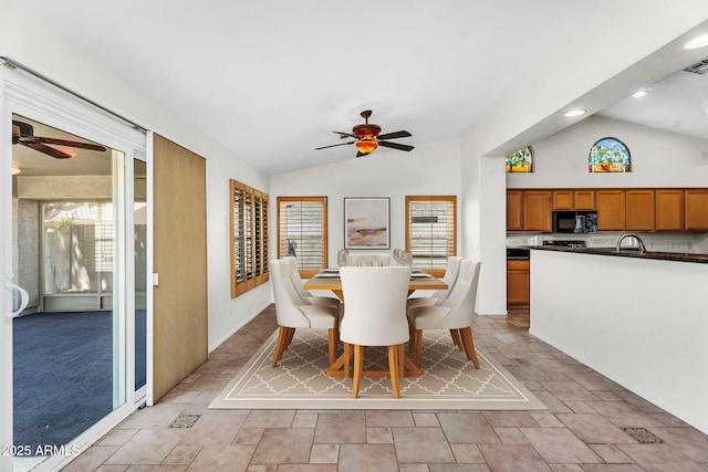 5529 E Holmes Ave, Mesa, AZ 85206 - dining room with vaulted ceiling, a ceiling fan, light stone finish floors, and recessed lighting