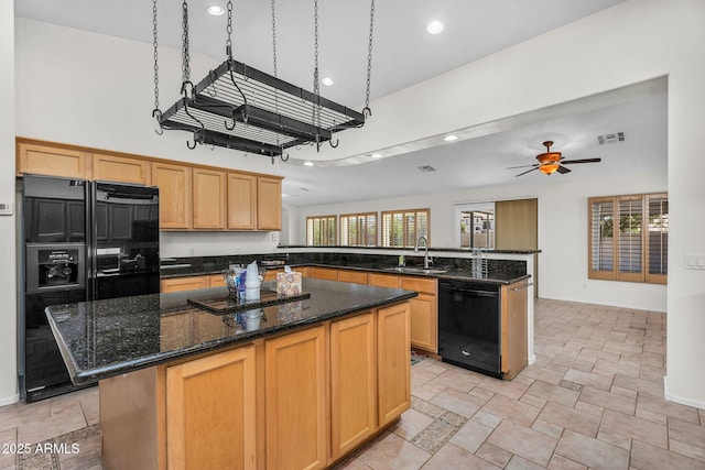 5529 E Holmes Ave, Mesa, AZ 85206 - kitchen featuring black appliances, recessed lighting, a peninsula, a towering ceiling, and a ceiling fan