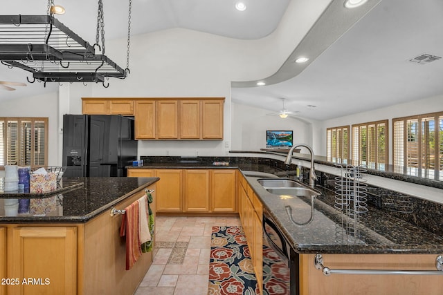 5529 E Holmes Ave, Mesa, AZ 85206 - kitchen with black fridge with ice dispenser, a ceiling fan, recessed lighting, high vaulted ceiling, and a kitchen island