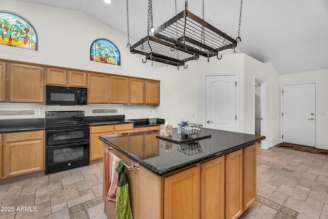 5529 E Holmes Ave, Mesa, AZ 85206 - kitchen with black appliances, high vaulted ceiling, stone finish floors, a center island, and dark stone countertops