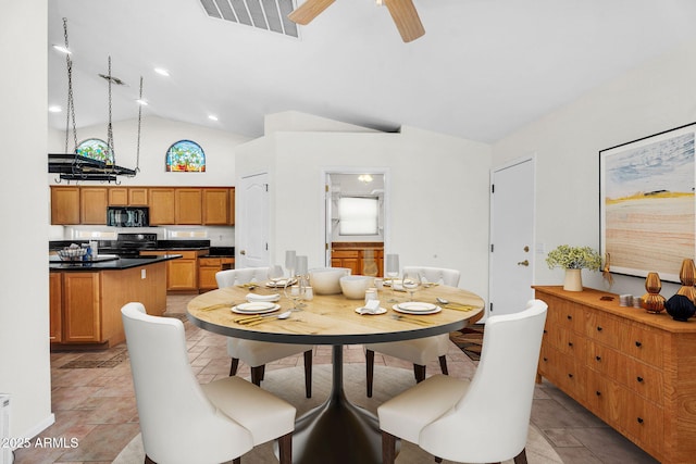 5529 E Holmes Ave, Mesa, AZ 85206 - dining space featuring ceiling fan, high vaulted ceiling, and light stone finish flooring