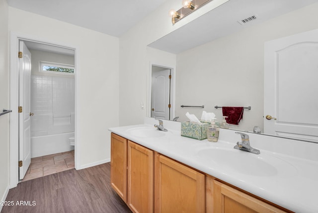 5529 E Holmes Ave, Mesa, AZ 85206 - bathroom featuring double vanity, wood finished floors, and  shower combination