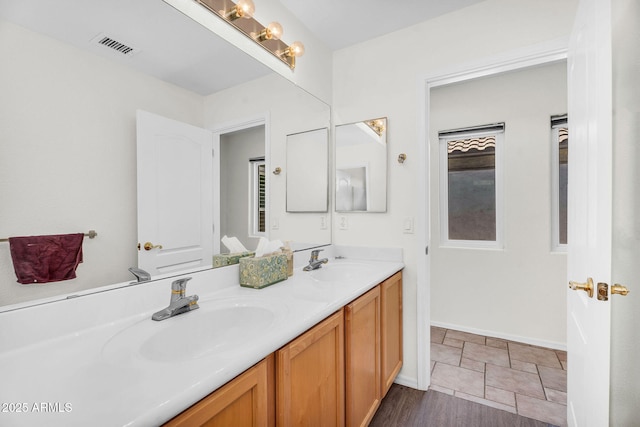 5529 E Holmes Ave, Mesa, AZ 85206 - bathroom with double vanity and baseboards