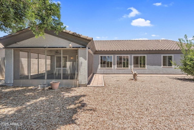 5529 E Holmes Ave, Mesa, AZ 85206 - rear view of house featuring a sunroom and a tile roof