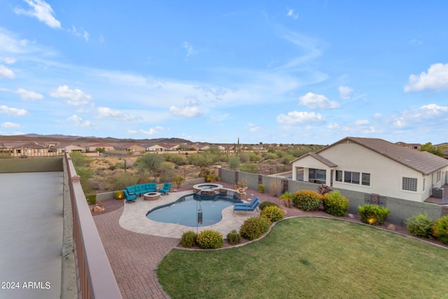 view of pool featuring a yard and a patio