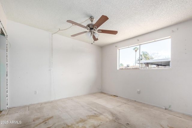 unfurnished room with a textured ceiling and a ceiling fan