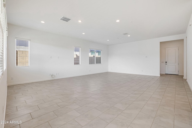 spare room featuring light tile floors