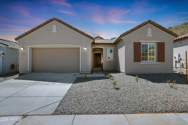 view of front of property featuring a garage