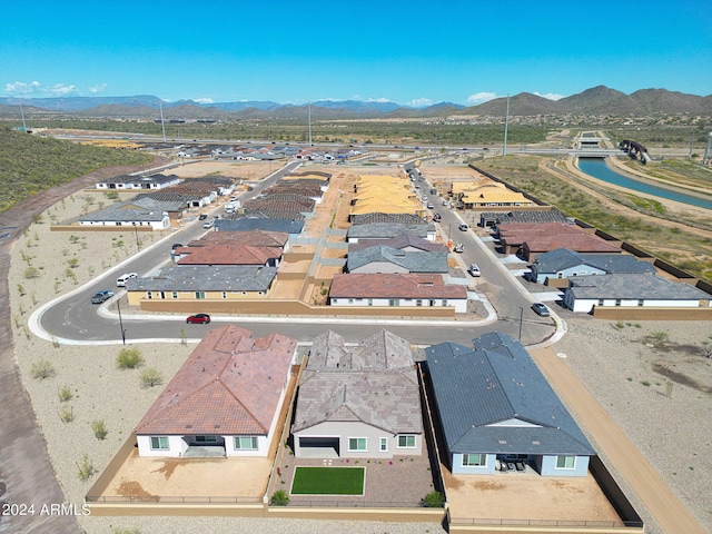 birds eye view of property with a mountain view