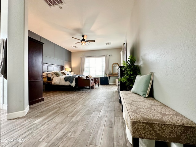 bedroom featuring light wood-type flooring and ceiling fan