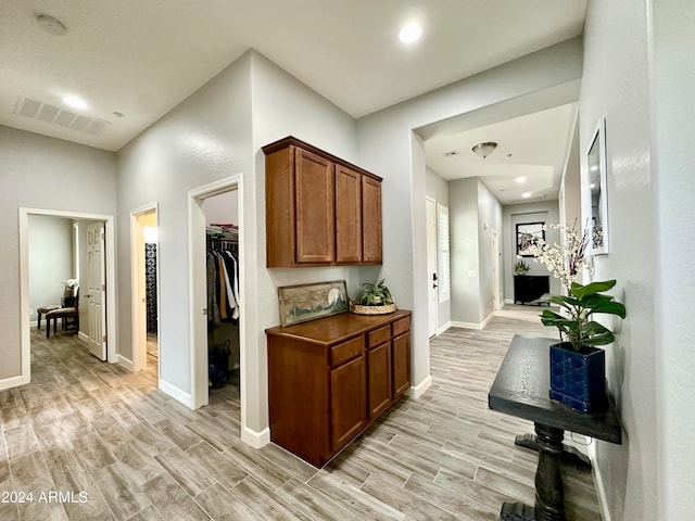 hallway featuring light hardwood / wood-style flooring