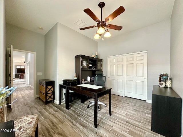 office featuring hardwood / wood-style floors and ceiling fan