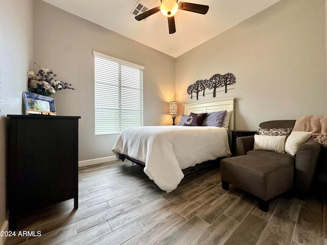 bedroom featuring hardwood / wood-style floors, ceiling fan, and vaulted ceiling