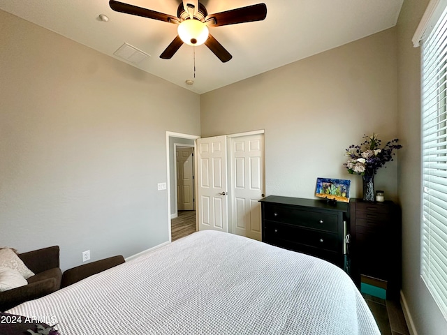 bedroom featuring ceiling fan and dark hardwood / wood-style floors