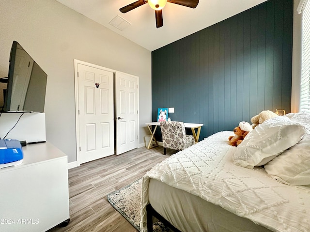 bedroom with ceiling fan and light hardwood / wood-style flooring