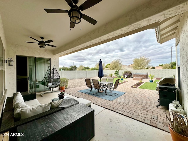 view of patio with ceiling fan, area for grilling, and an outdoor hangout area