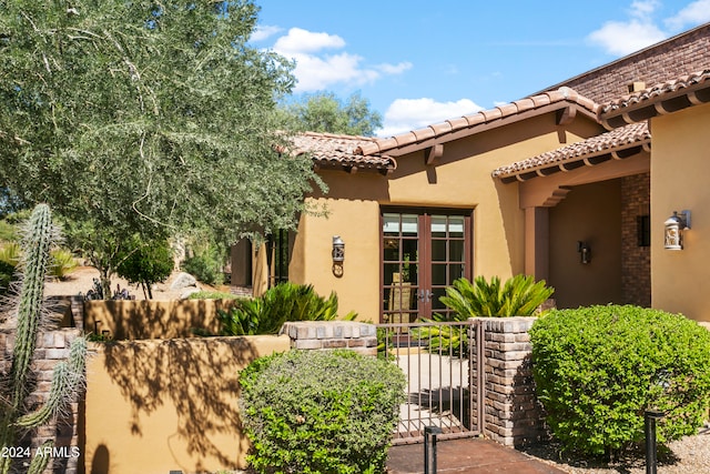 entrance to property featuring french doors