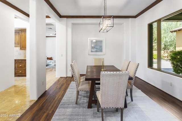 kitchen with sink, stainless steel appliances, light stone counters, a kitchen island with sink, and custom exhaust hood