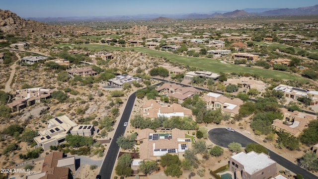 birds eye view of property with a mountain view