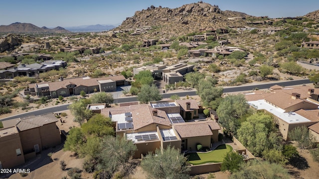 birds eye view of property with a mountain view