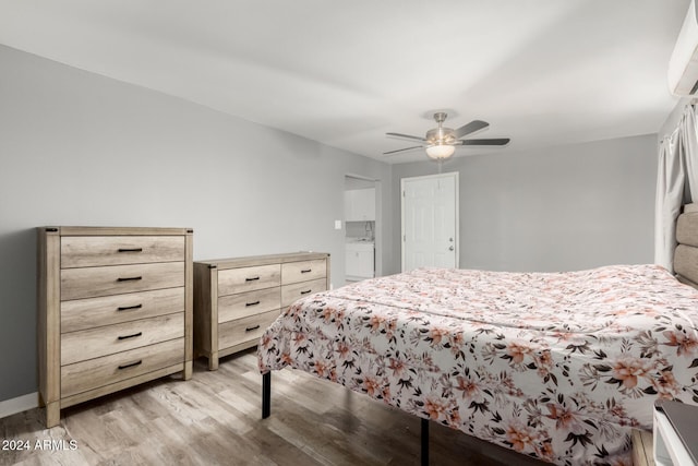 bedroom with ceiling fan and light wood-type flooring