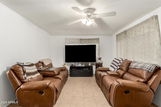 living room with light tile patterned floors and ceiling fan