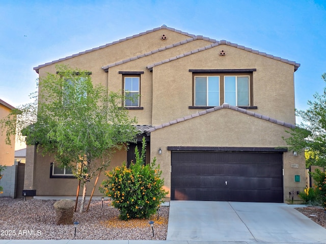 19954 W Moonlight Path, Buckeye, AZ 85326 - view of front of house with a garage, driveway, stucco siding, and a tile roof