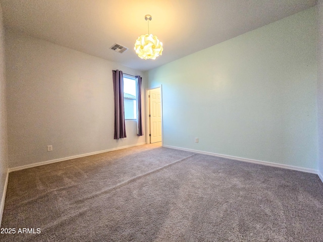 19954 W Moonlight Path, Buckeye, AZ 85326 - carpeted spare room with a chandelier and baseboards