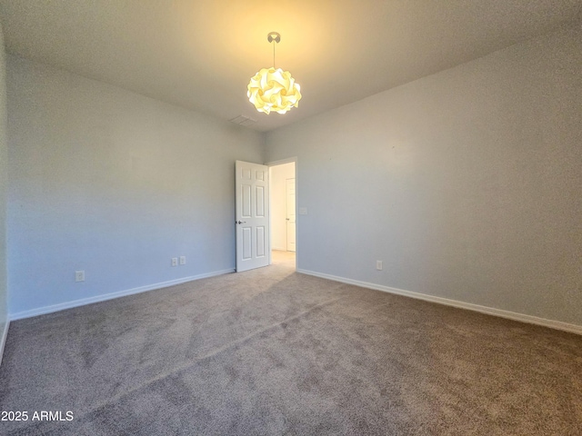 19954 W Moonlight Path, Buckeye, AZ 85326 - carpeted spare room with a chandelier and baseboards