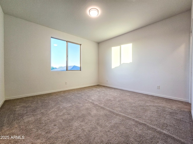 19954 W Moonlight Path, Buckeye, AZ 85326 - unfurnished room with carpet floors and baseboards