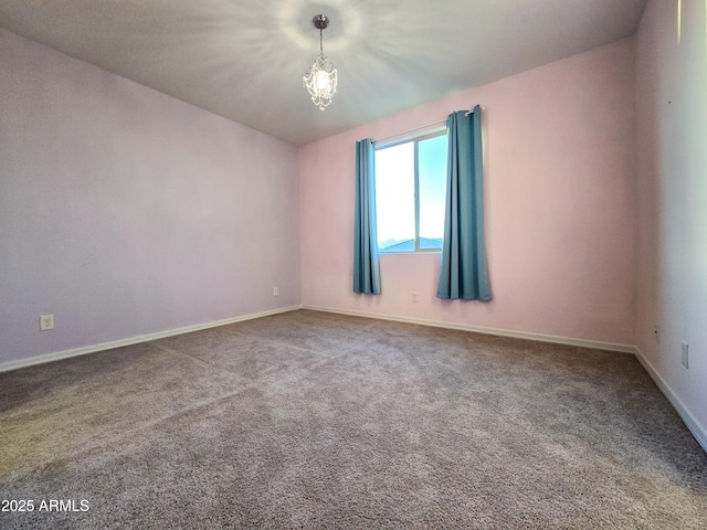 19954 W Moonlight Path, Buckeye, AZ 85326 - spare room with carpet floors, baseboards, and a chandelier