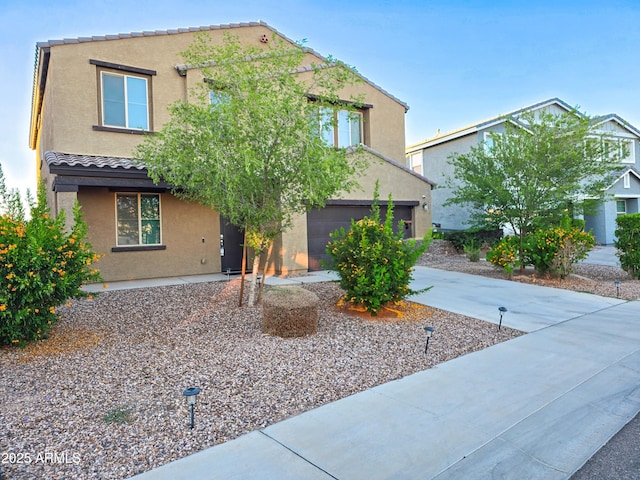 19954 W Moonlight Path, Buckeye, AZ 85326 - view of front of property featuring driveway, stucco siding, a garage, and a tile roof