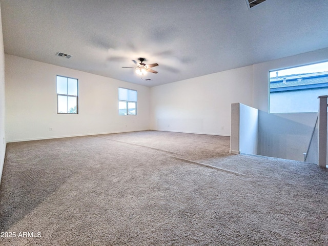 19954 W Moonlight Path, Buckeye, AZ 85326 - carpeted empty room featuring a ceiling fan, baseboards, and a textured ceiling