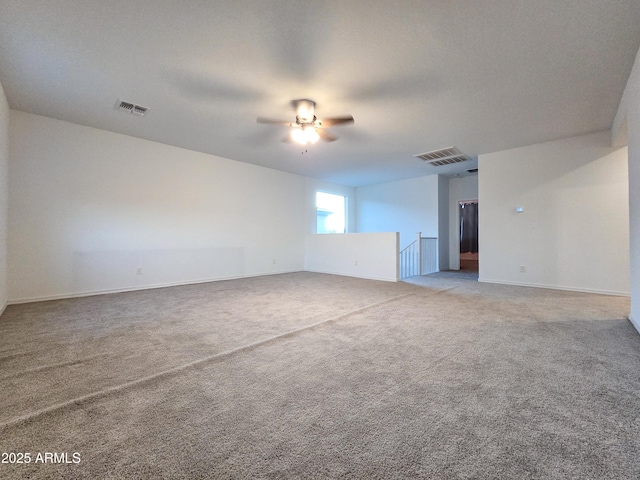 19954 W Moonlight Path, Buckeye, AZ 85326 - empty room with light colored carpet, a ceiling fan, and baseboards