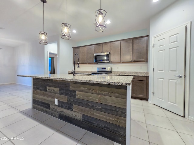 19954 W Moonlight Path, Buckeye, AZ 85326 - kitchen with stainless steel appliances, a sink, light tile patterned floors, dark brown cabinetry, and recessed lighting