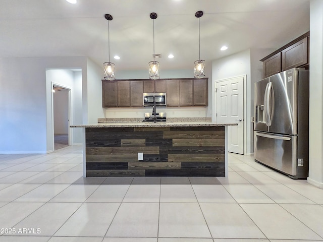 19954 W Moonlight Path, Buckeye, AZ 85326 - kitchen featuring stainless steel appliances, dark brown cabinets, light stone countertops, pendant lighting, and recessed lighting